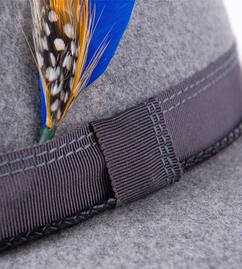 hatband of grey fedora hat with feather