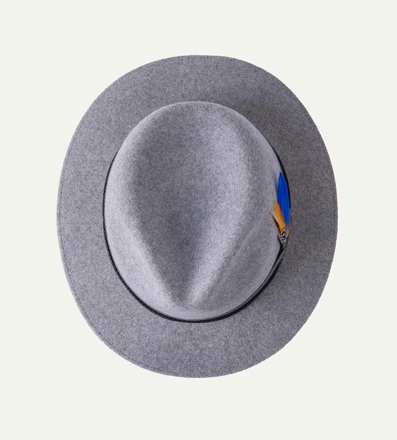 top view of grey fedora hat with feather