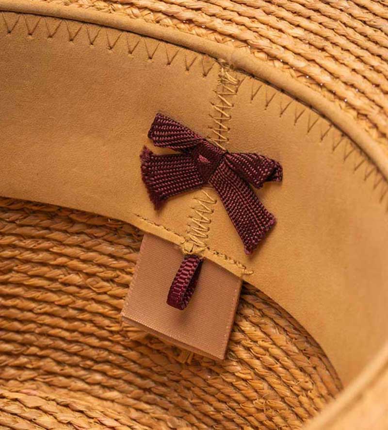 detail of flat straw hat