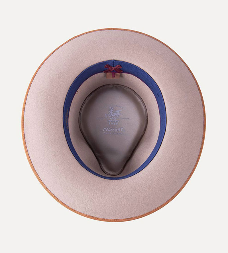 inside view of beige teardrop fedora hat with feather