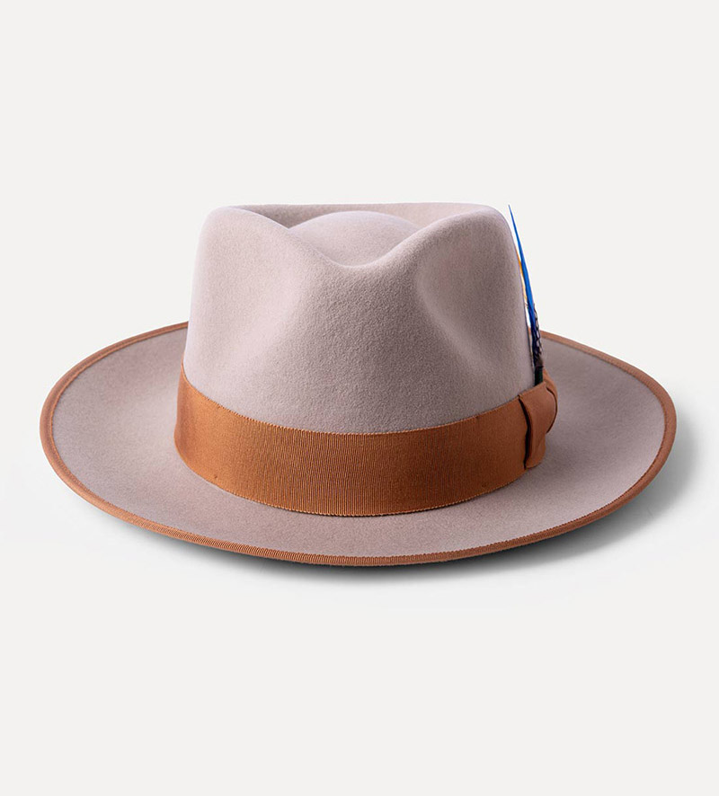 front view of beige teardrop fedora hat with feather