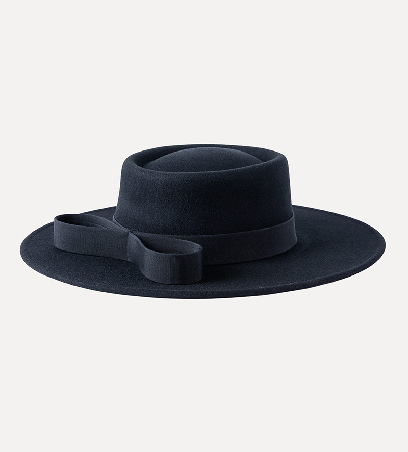 oblique view of black wide brim pork pie hat