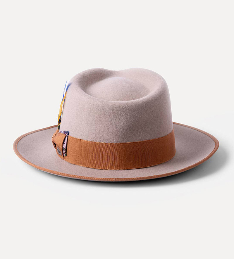 back view of beige teardrop fedora hat with feather