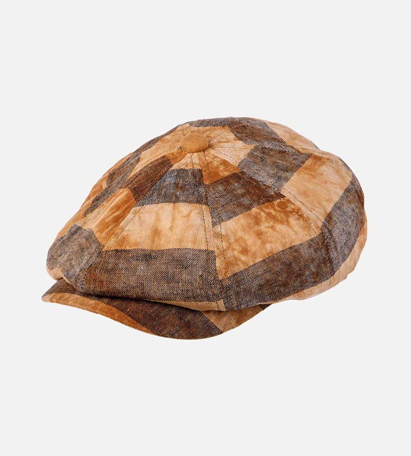 oblique view of plaid newsboy cap