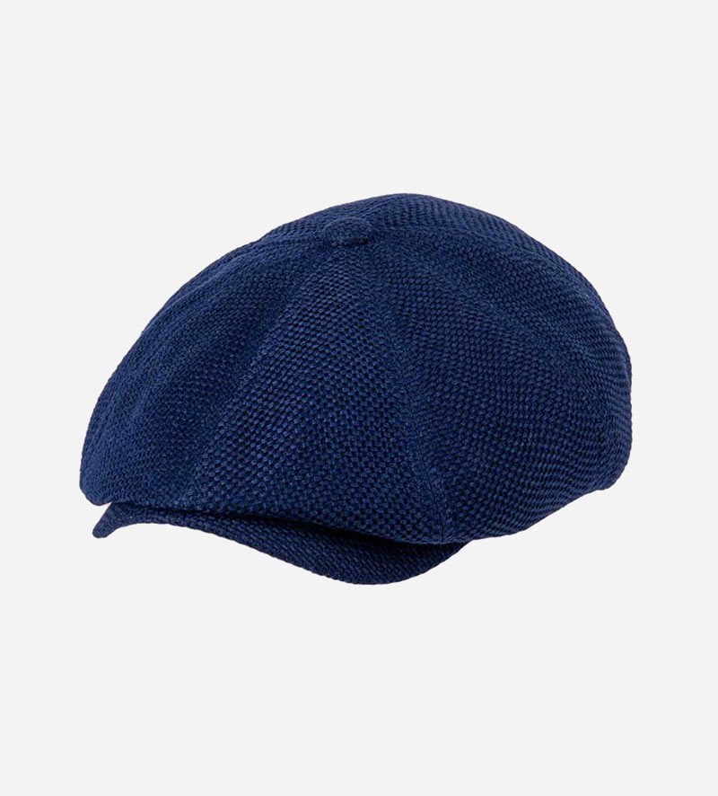 oblique view of newsboy flat cap