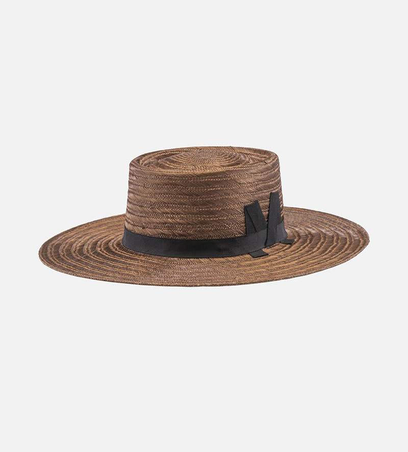 oblique view of large brim straw hat