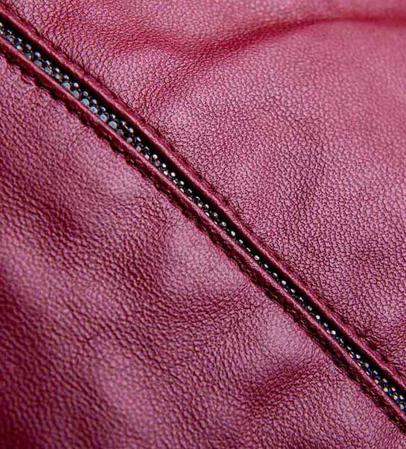 detail of womens maroon beret