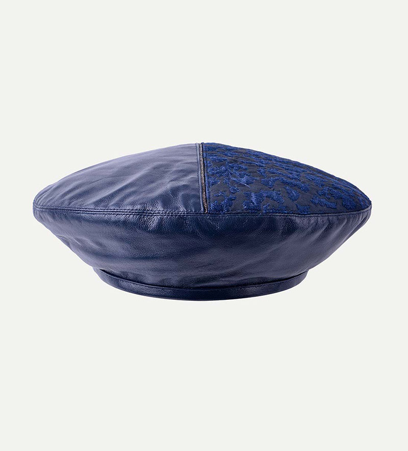 front view of womens blue leather beret