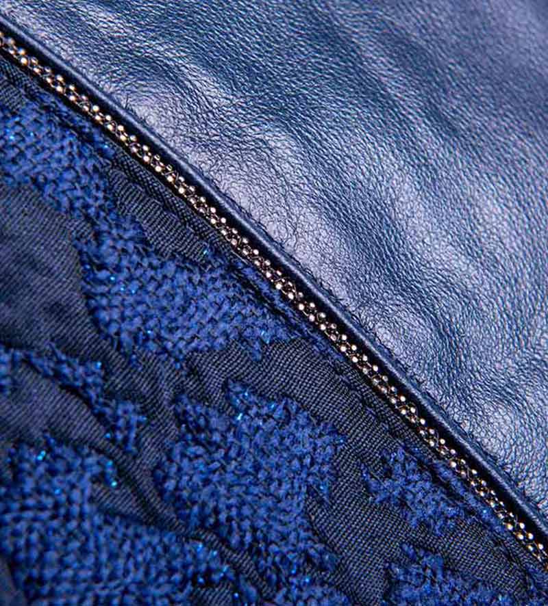 detail of womens blue leather beret