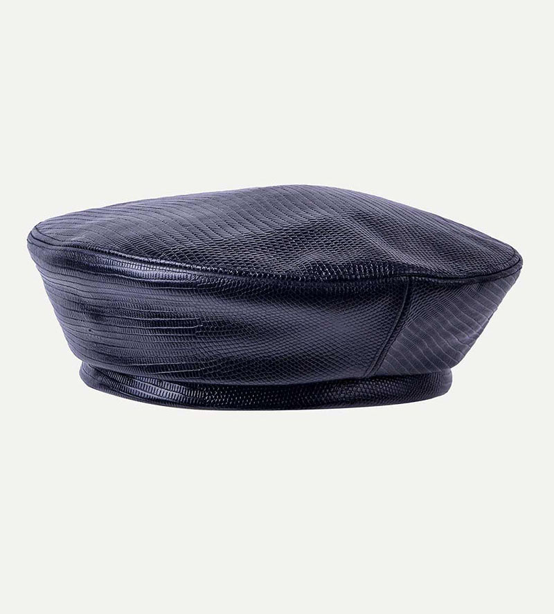 oblique view of womens black leather beret