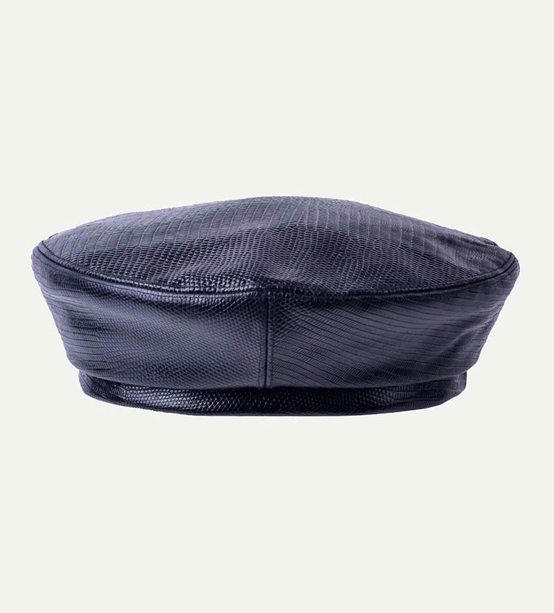 side view of womens black leather beret