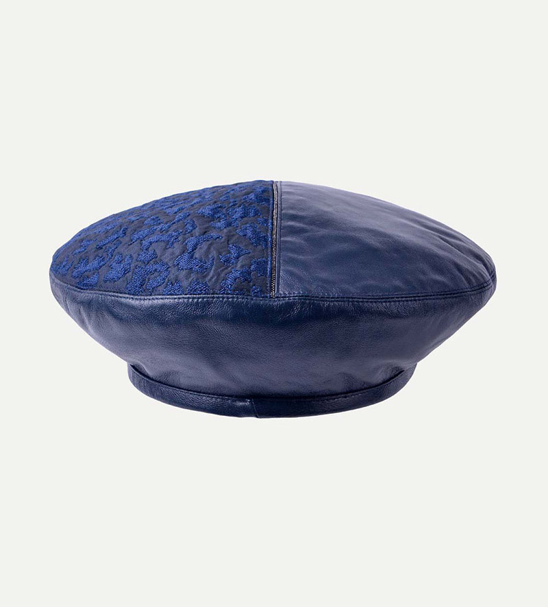 back view of womens blue leather beret