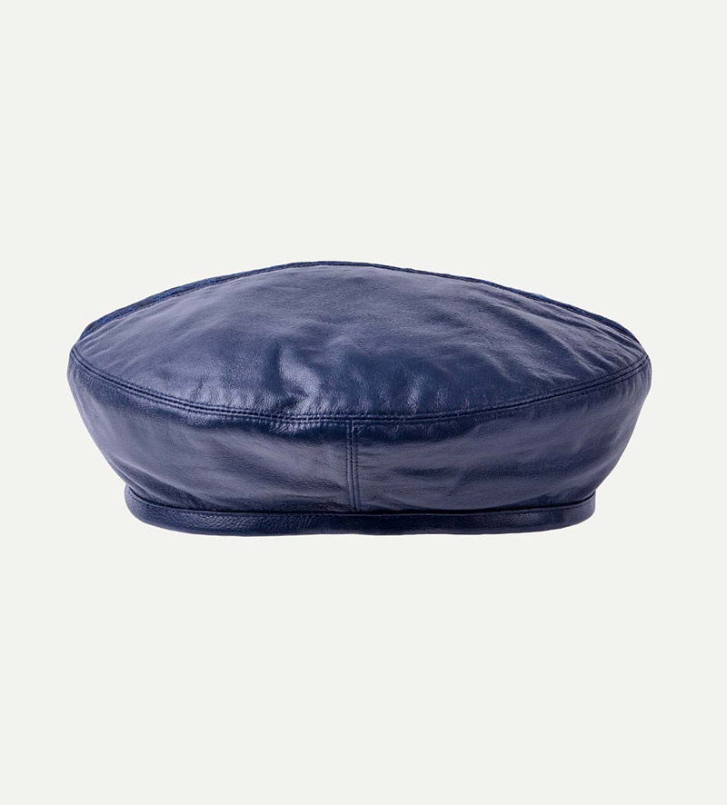 side view of womens blue leather beret