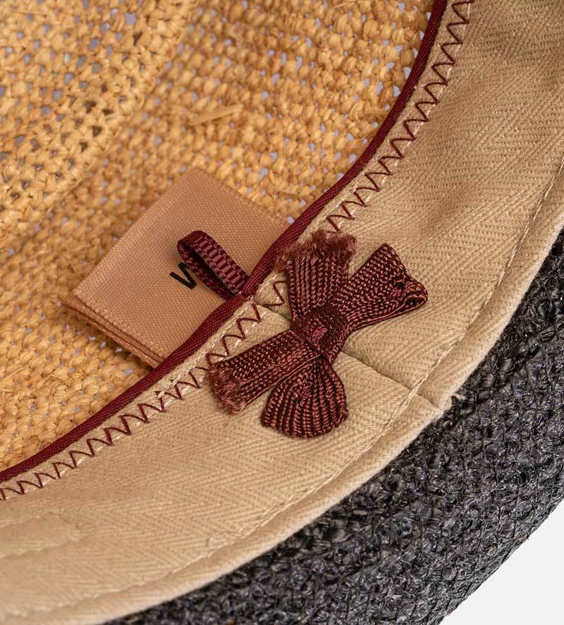detail of straw porkpie hat
